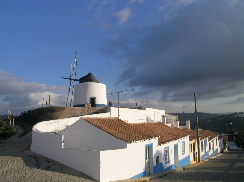 Old windmill above the pretty village of Odeceixe